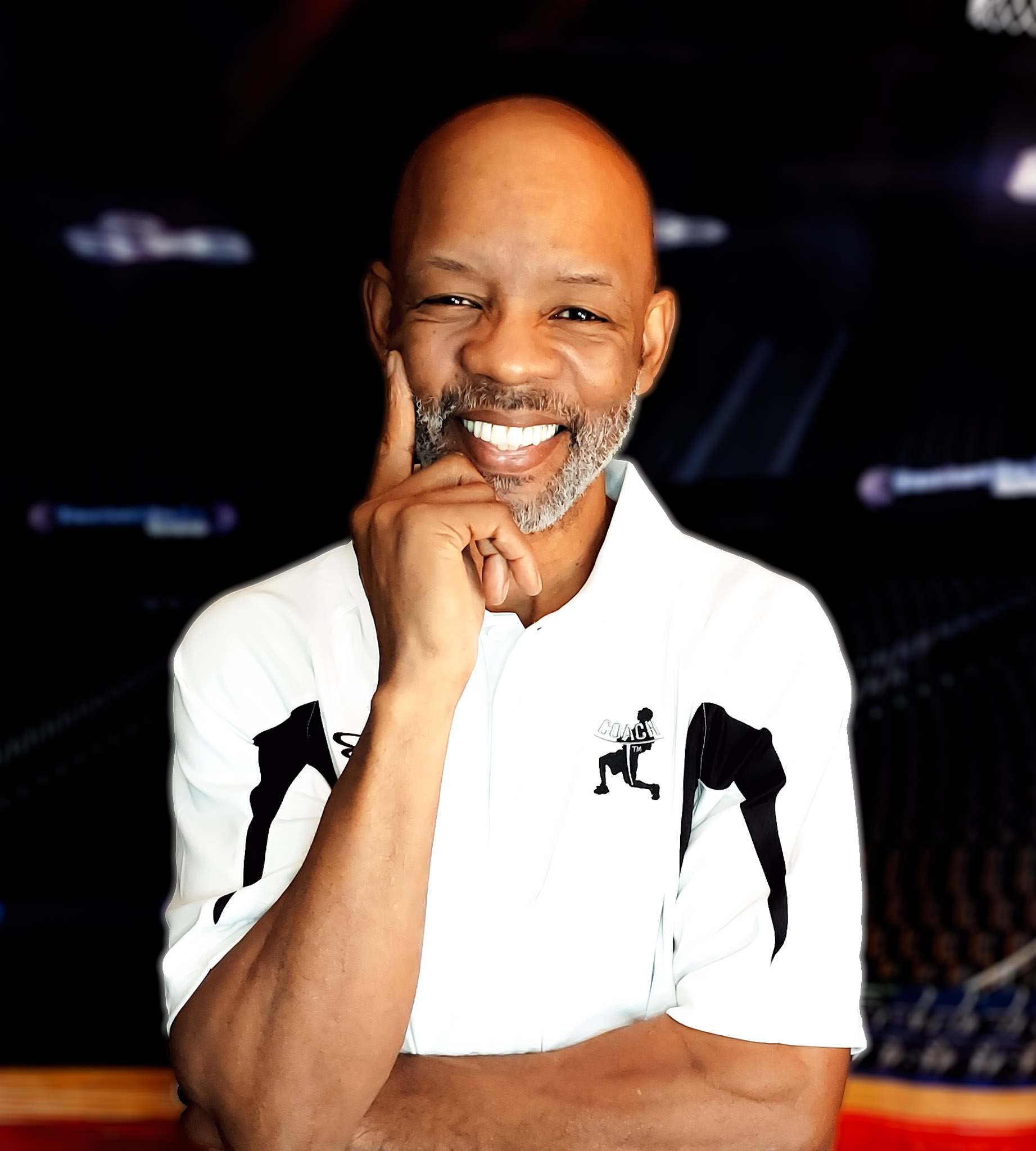 Antwaun Coach T Thompson smiling in a white coaching polo